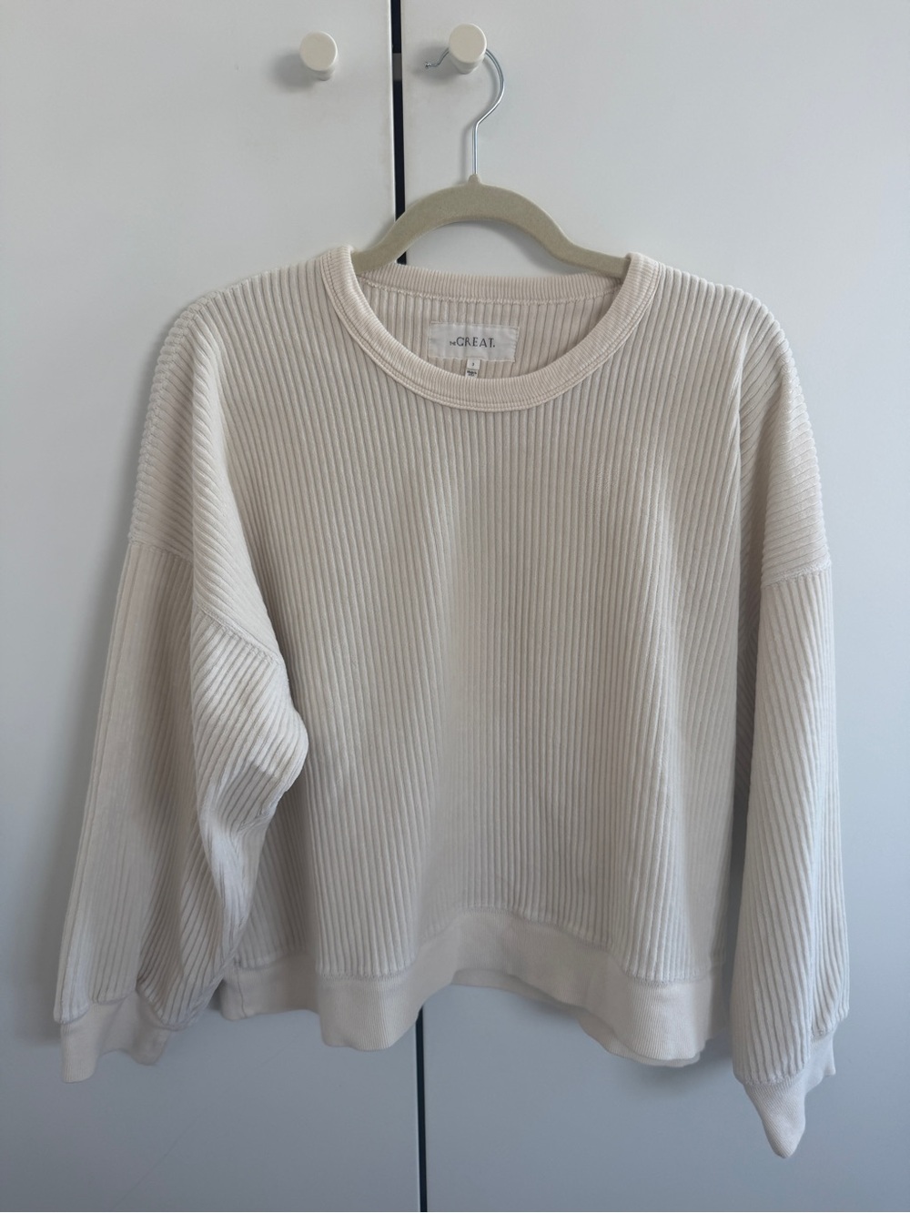 THE GREAT. Ribbed Crewneck Corduroy Sweatshirt in Cream